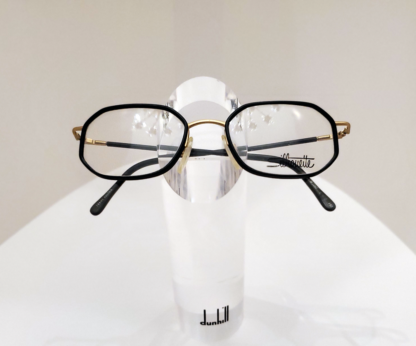 A pair of SilhouetteM7267 glasses presented on a transparent glass stand.